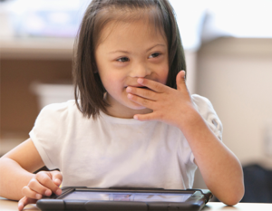 Happy Girl Smiling While Using iPad